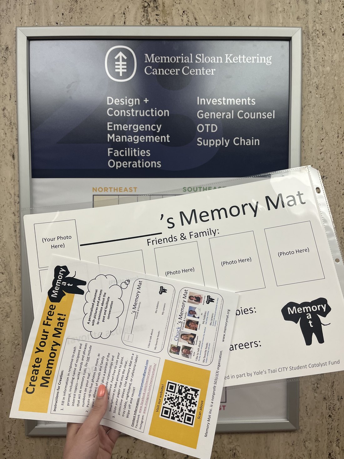 Memory Mat craft materials in front of a Memorial Sloan Kettering Cancer Center directory