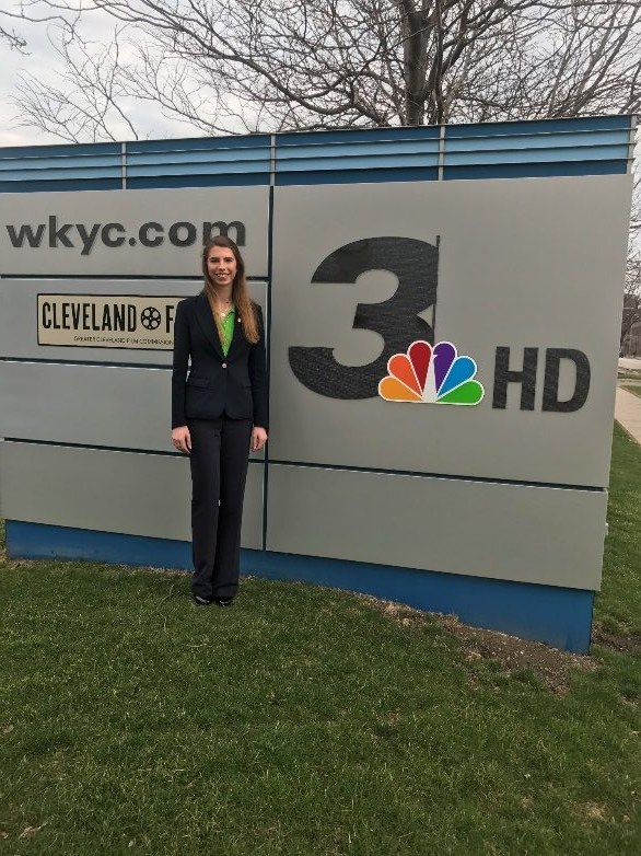 Ava Thomas in front of the WKYC Channel 3 news sign in Cleveland
