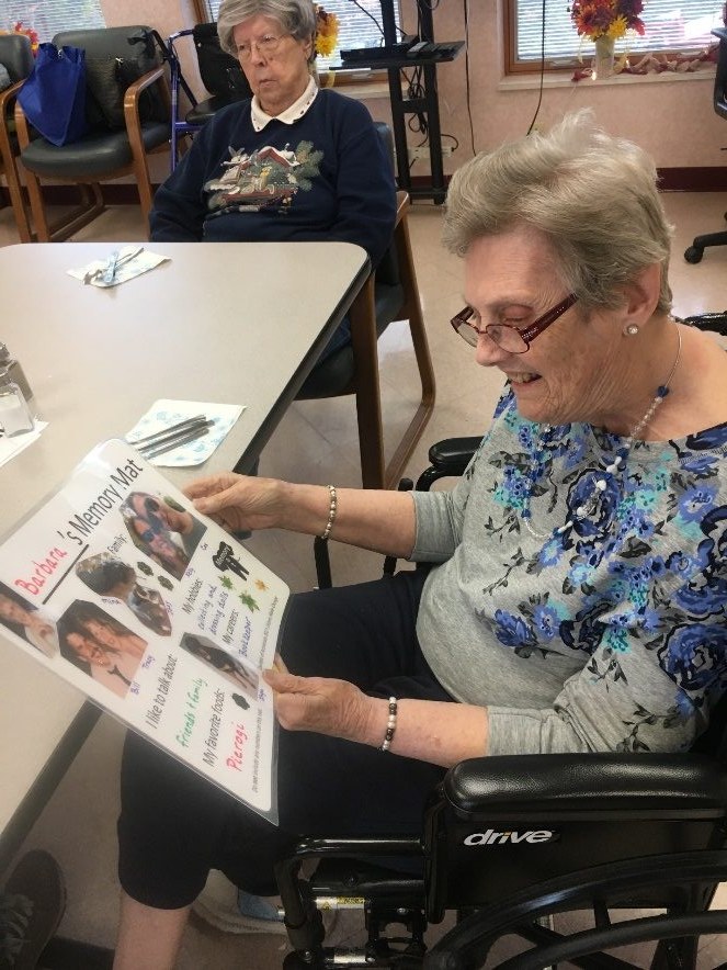 Seniors gathered at tables during a Memory Mat session